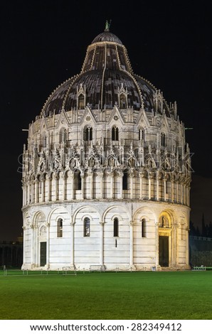 Evening. Pisa Baptistry stand on Piazza dei Miracoli in Pisa.The round Romanesque building was begun in the mid 12th century. It is the largest baptistery in Italy
