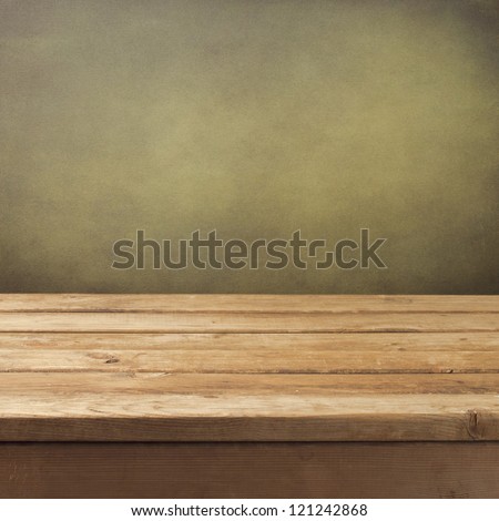 Retro background with wooden table and grunge wall