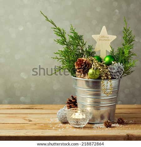 Christmas table decoration with balls and pine corn