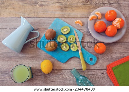 Healthy fruits and juice on wooden table. View from above