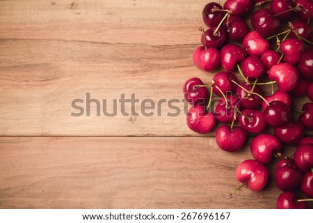 Food background with fresh cherries with retro filter effect. View from above
