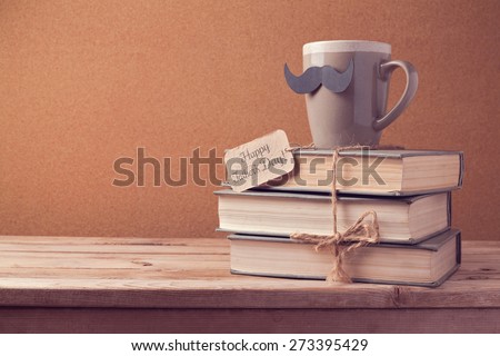 Cup of tea and old books for Father\'s Day celebration