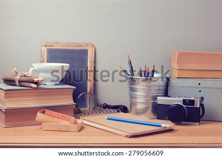 Creative process concept. Retro artistic objects on wooden desk