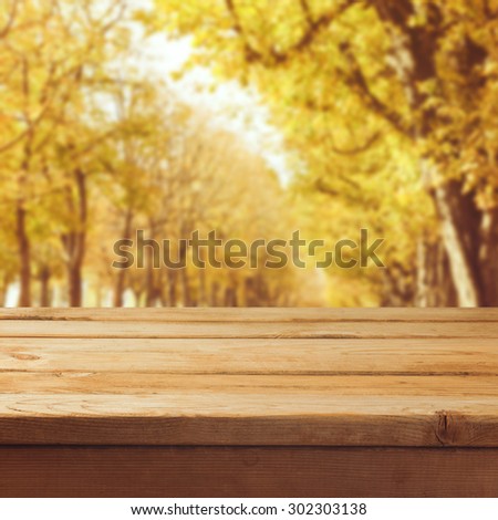 Fall nature background with empty wooden table