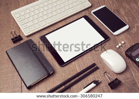 Organized office objects on table. Digital tablet mock up