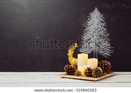 Candles and pine corn decorations on wooden table for Christmas