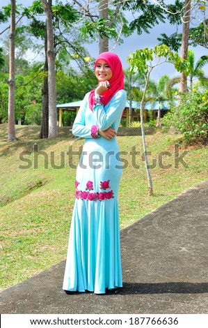 Beautiful muslimah lady wear blouse and hijab posing at garden