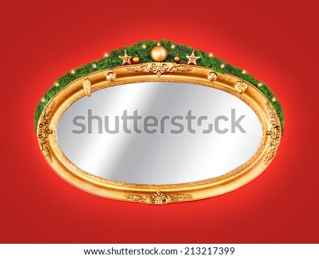 Gold frame mirror decorated with christmas balls and lights on red wall