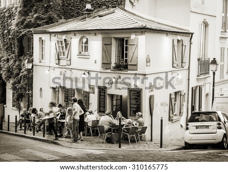 PARIS, FRANCE - AUGUST 10: Facade of \'La Maison Rose\' cafe and restaurant in Montmartre - old famous historical artistic area on August 10, 2015 in Paris, France.