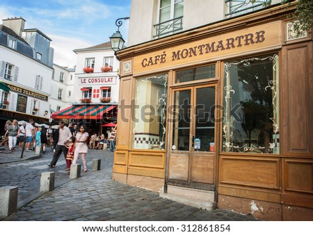 PARIS, FRANCE - AUGUST 2: Cafes and restaurants facades in Montmartre - old famous historical artistic area on August 2, 2015 in Paris, France.