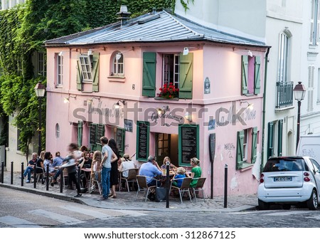 PARIS, FRANCE - AUGUST 2: Facade of \'La Maison Rose\' cafe and restaurant in Montmartre - old famous historical artistic area on August 2, 2015 in Paris, France.