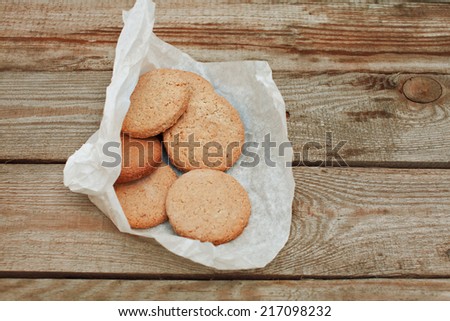 crispy cereal cookies on wooden table