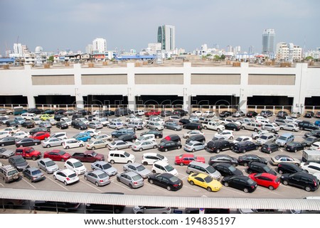 BANGKOK- MAT 25:Cars parked at a park and side lot at a BTS station in Chatuchak district on May 25,2014 in Bangkok,Thailand.Th e government has promoted park and ride to reduce traffic congestion.