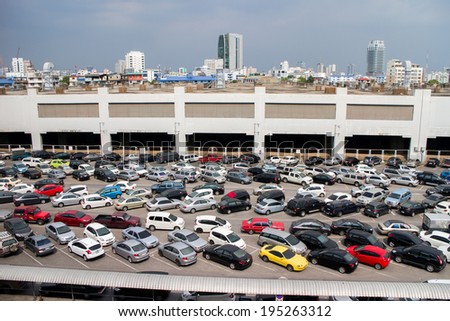 BANGKOK- MAT 25:Cars parked at a park and side lot at a BTS station in Chatuchak district on May 25,2014 in Bangkok,Thailand.The government has promoted park and ride to reduce traffic congestion.