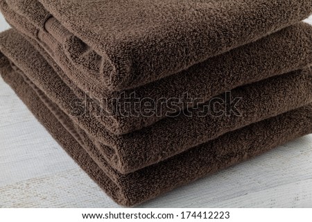 Stack of brown, organic cotton towels.