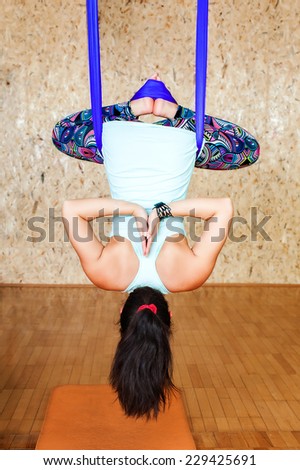 Woman doing antigravity Aerial yoga