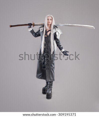 Fantasy woman warrior. Woman warrior with sword and armor isolated on the gray background