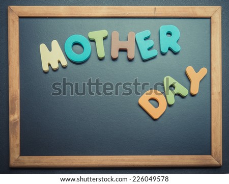 Mother day wooden word on black board