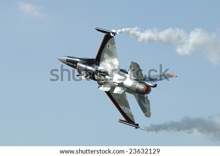 FAIRFORD, UK - JULY 16: Dutch F-16 in a special paint scheme takes off during an air demonstration at the Royal International Air Tattoo on July 16, 2005 in Fairford, UK.