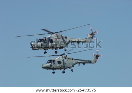 FAIRFORD, UK - JULY 16, 2005: Royal Navy HAS3 Lynx helicopters performs a flypast during an air demonstration at the Royal International Air Tattoo on July 16, 2005 in Fairford, UK.
