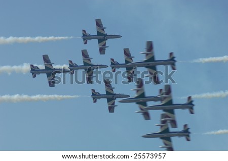 FAIRFORD, UK - JULY 16: Italian Frecce Tricolori 9 ship opposing pass an air display at the Royal International Air Tattoo on July 16, 2005 in Fairford, UK.
