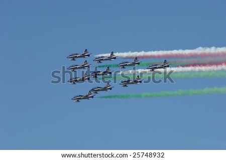 FAIRFORD, UK - JULY 16: Italian Frecce Tricolori 10 ship delta flypast with tricolor smoke during an air display at the Royal International Air Tattoo on July 16, 2005 in Fairford, UK.