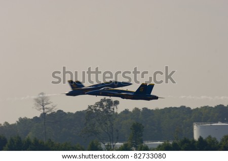 VIRGINIA BEACH, VA - SEPT 17:  USN Blue Angel solos opposing pass during the NAS Oceana Air Show on September 17, 2005  in Virginia Beach. VA.