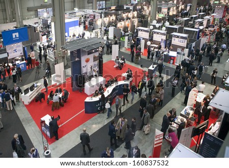 MILAN, ITALY - OCT. 25: Booth with people from above at Smau, international fair of information and communication technology on October 25, 2013 in Milan, Italy