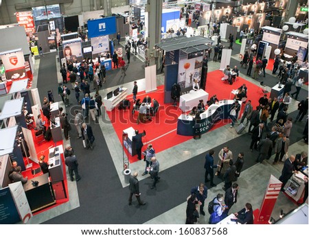 MILAN, ITALY - OCT. 25: Booth with people from above at Smau, international fair of information and communication technology on October 25, 2013 in Milan, Italy