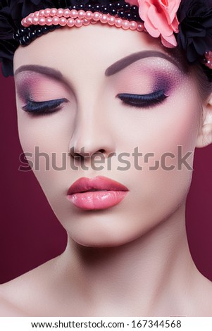 Woman beautiful face closeup fashion portrait pink make up
