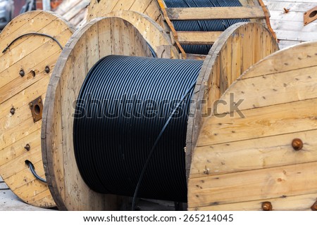 Wooden Coils Of Electric Cable Outdoor. Industrial Object Photo