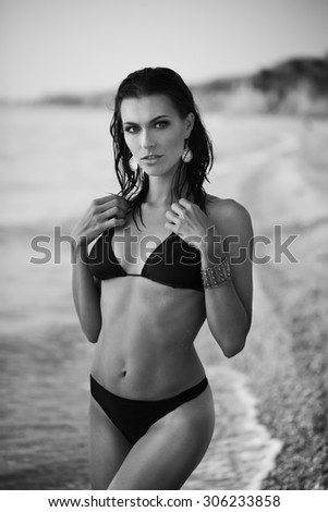sexy girl with make up of the sea in swimsuit black and white photo