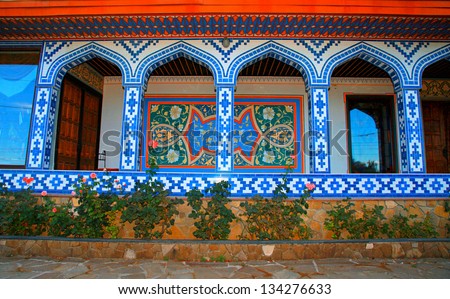 Arabic house with decorative arches and walls covered ornamental tiles