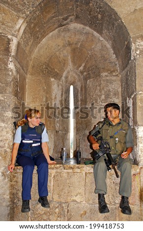 JERUSALEM, ISRAEL - JULY 23,2007: Male and female members of the Israeli Army Police in the Old City of Jerusalem, Israel.