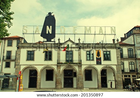 PORTO, PORTUGAL - MAY 06, 2009: Sandeman Advertising Signboard on Porto Building roof, Porto, Portugal. Sandeman is famous Portugal Portwein brand.