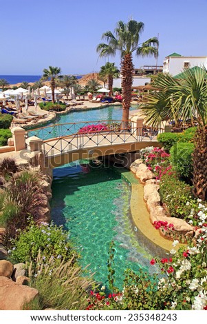 SHARM EL SHEIKH, EGYPT - MAY 03, 2014: Tropical luxury resort hotel with swimming pool on Red Sea beach in Sharm el Sheikh, Egypt.