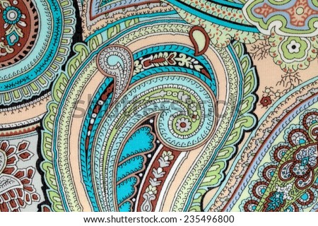 colorful vintage fabric with blue and beige paisley print