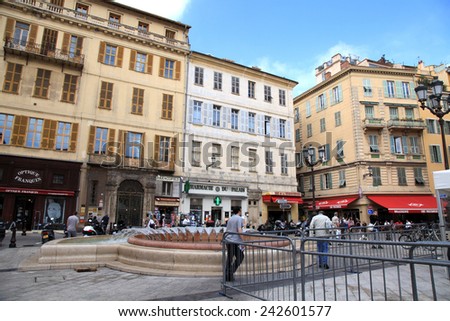 NICE, FRANCE - MAY 14, 2013: Local people and tourists at Old Town district, near Cours Saleya, most famous City Market, famous location of many cafes and restaurants, Nice, France.