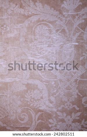 Vintage beige wallpaper with shabby fabric victorian pattern