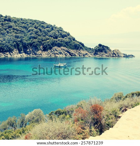 Mediterranean landscape with beautiful turquoise bay, Ammouliani island, Halkidiki. Square toned image, instagram effect