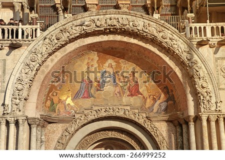Medieval mosaic fresco on famous Patriarchal Cathedral Basilica  facade on San Marco Square in Venice (Venezia), Italy