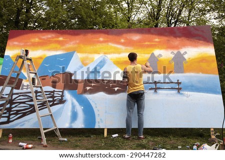 KIEV, UKRAINE - MAY 01, 2015: Painters graffiti during the course of Street Art Festival, Kiev, Ukraine