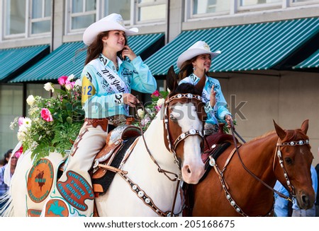 Portland, Oregon, USA - JUNE 7, 2014: Northwest Youth Rodeo Association Court in Grand floral parade through Portland downtown.