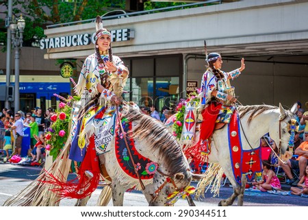 Portland, Oregon, USA - June 6, 2015: Royal Court of the Happy Canyon Night Show in the Grand Floral Parade during Portland Rose Festival 2015.