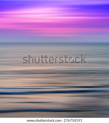 Vertical vivid vibrant pink ocean sunset landscape motion blur abstraction background backdrop
