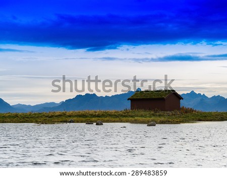 Horizontal vivid Norway house cabin near mountains background backdrop