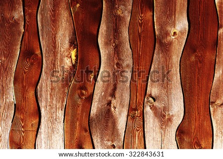 Vertical curved rusty brown boards textured background