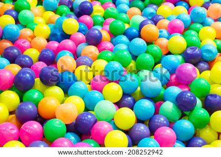 Multi-colored plastic balls colorful plastic balls on children\'s playground  red blue yellow bright orange plastic small