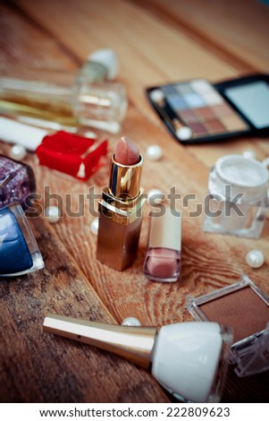 Various makeup products on  wooden background