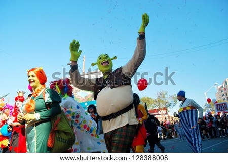 LIMASSOL,CYPRUS - FEBRUARY 26, 2012:Grand Carnival Parade - People of all ages ,gender and nationality in colorful costumes on the carnival on February , 2012 in Limassol, Cyprus.Shrek costume.